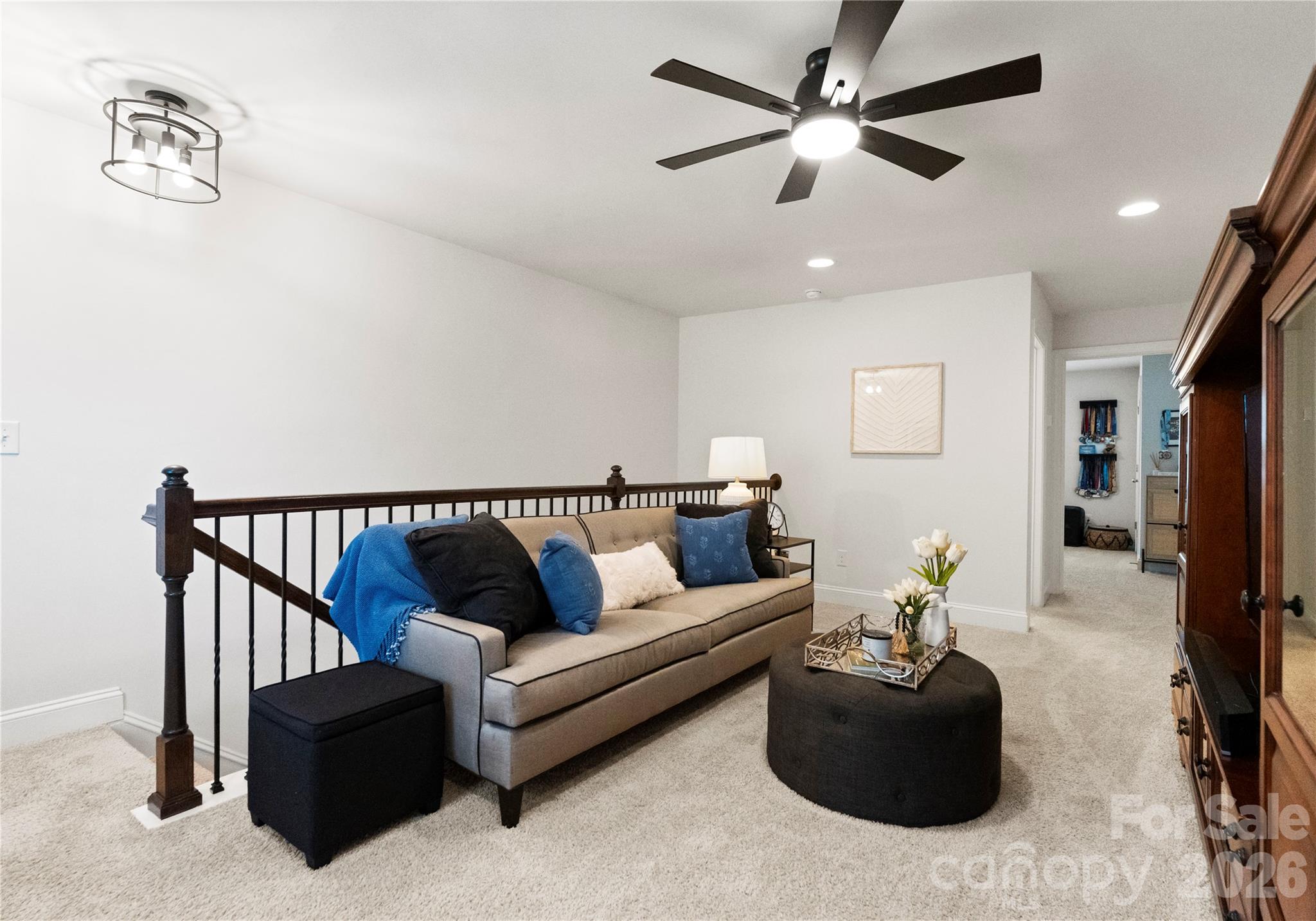 349 Preston Road Mooresville, NC 28117 - Photo 27 of 48 a living room with furniture and a chandelier