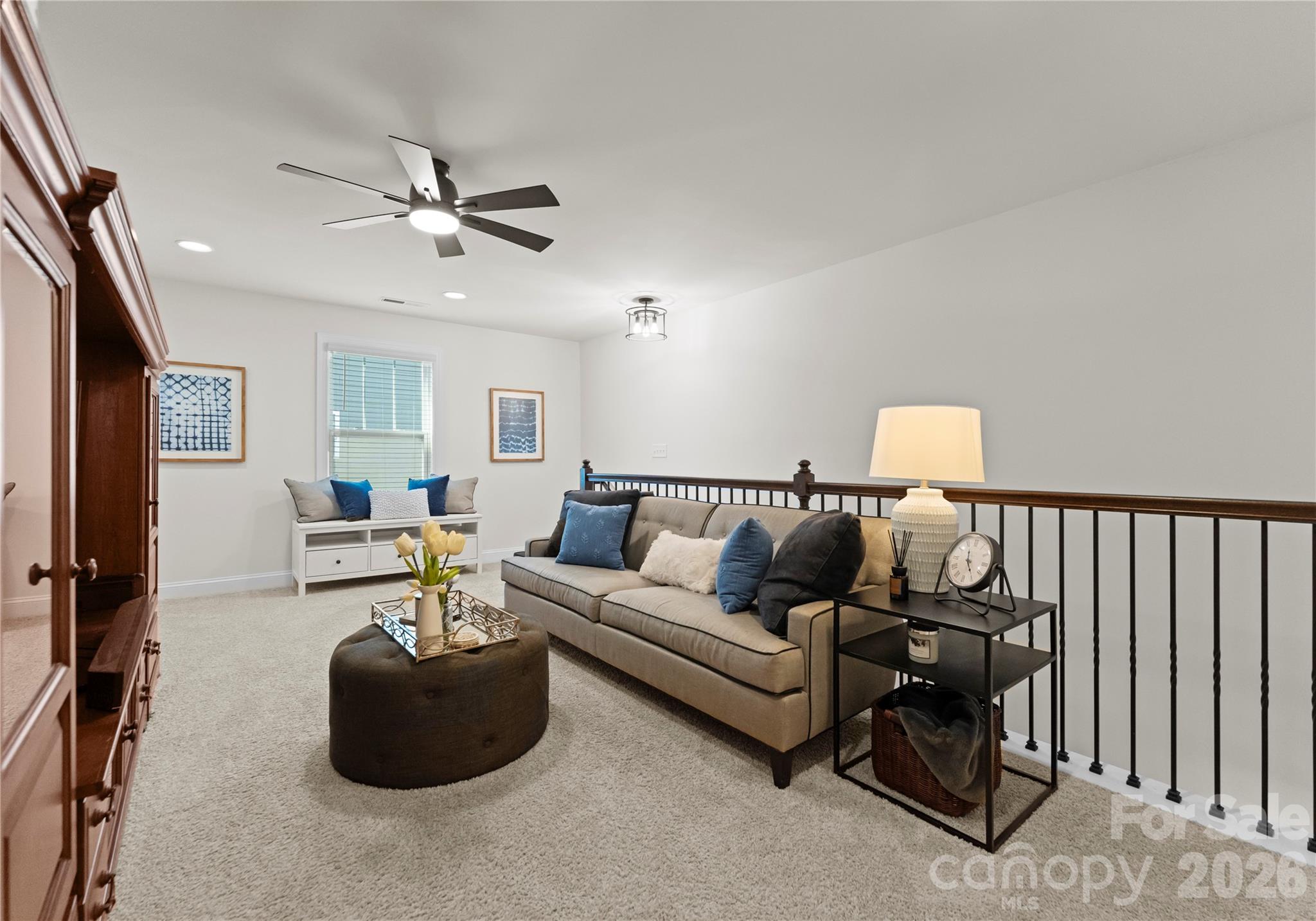 349 Preston Road Mooresville, NC 28117 - Photo 29 of 48 a living room with furniture and a ceiling fan