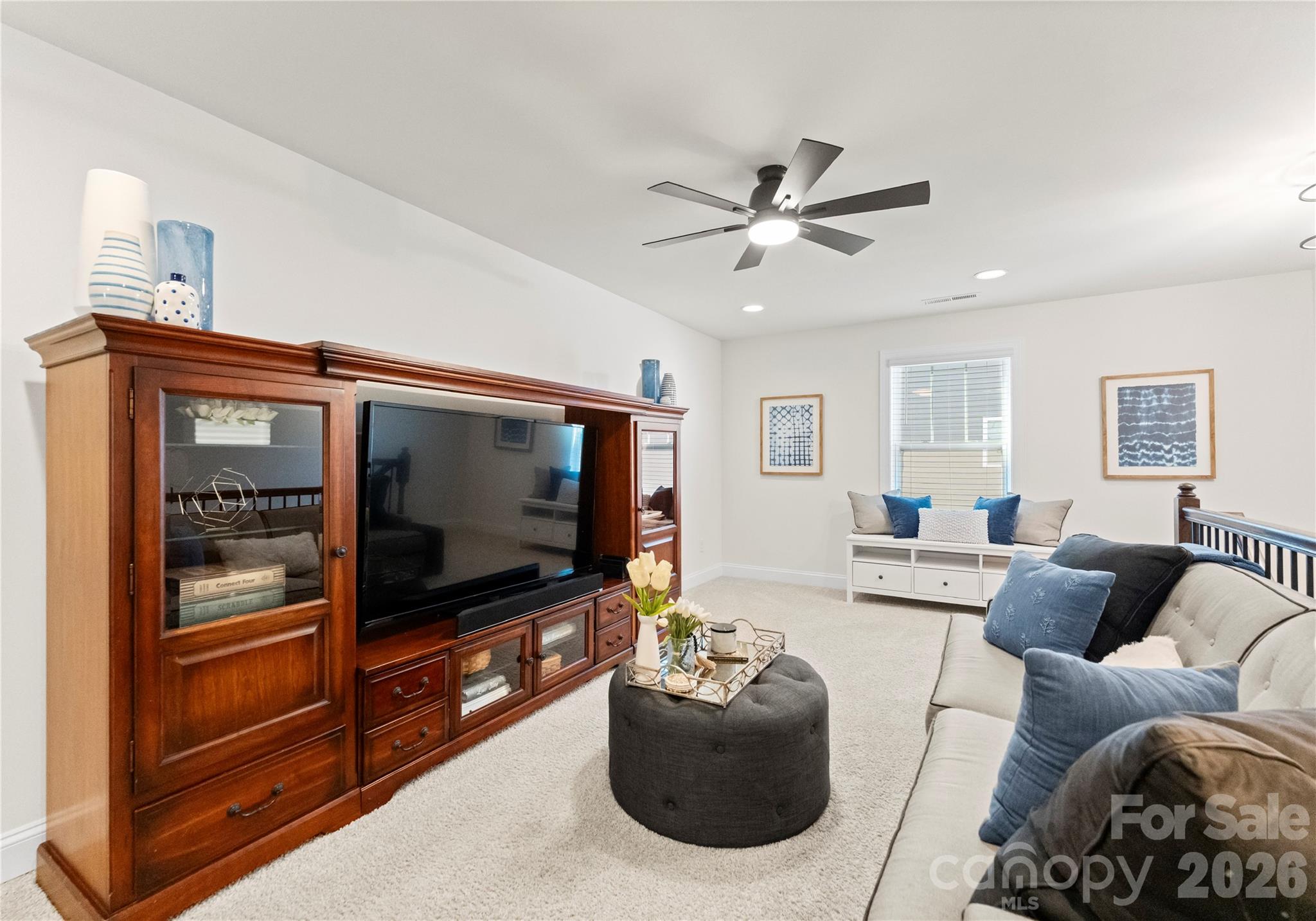 349 Preston Road Mooresville, NC 28117 - Photo 30 of 48 a living room with furniture and a flat screen tv