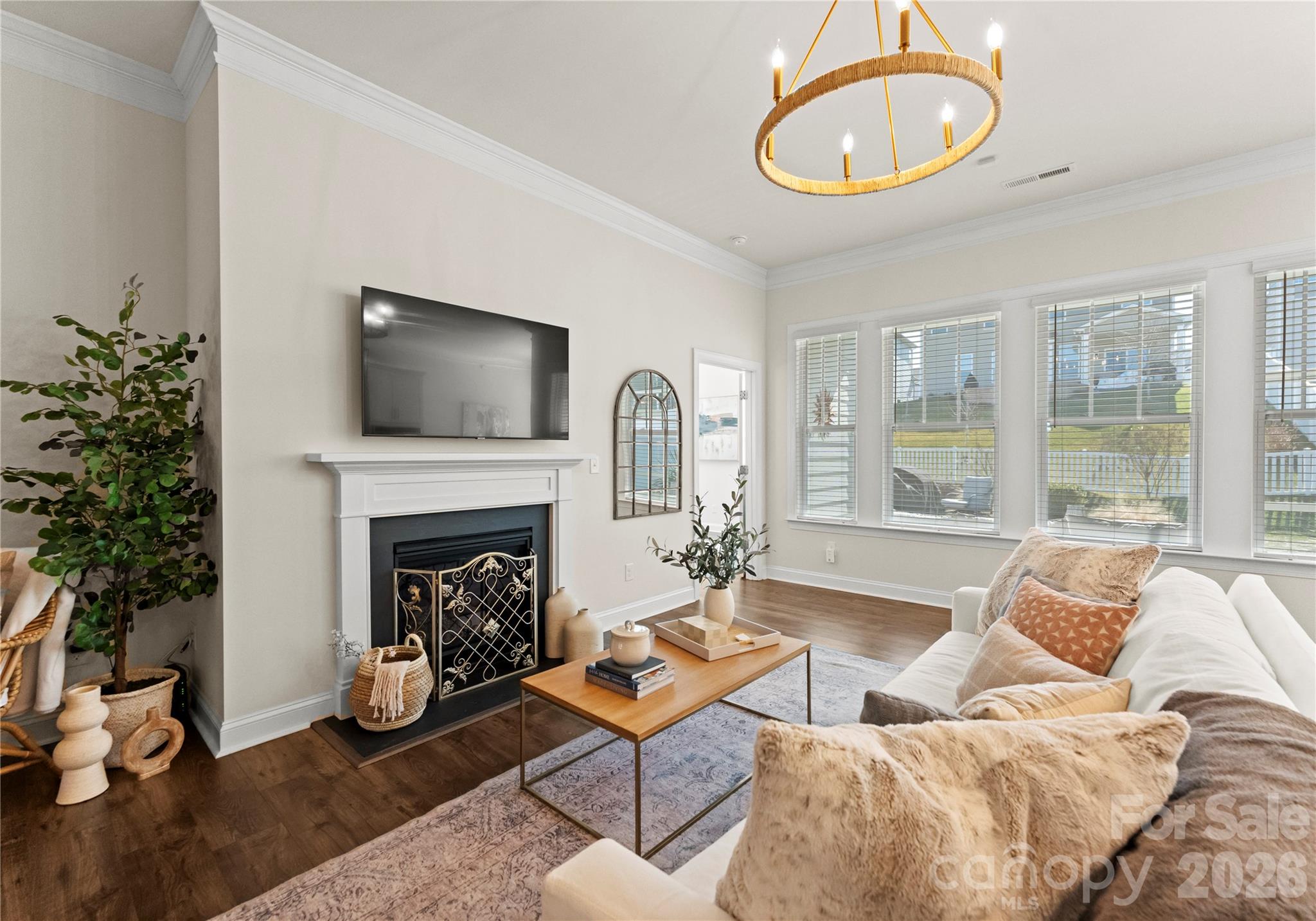 349 Preston Road Mooresville, NC 28117 - Photo 7 of 48 a living room with furniture a fireplace and a large window