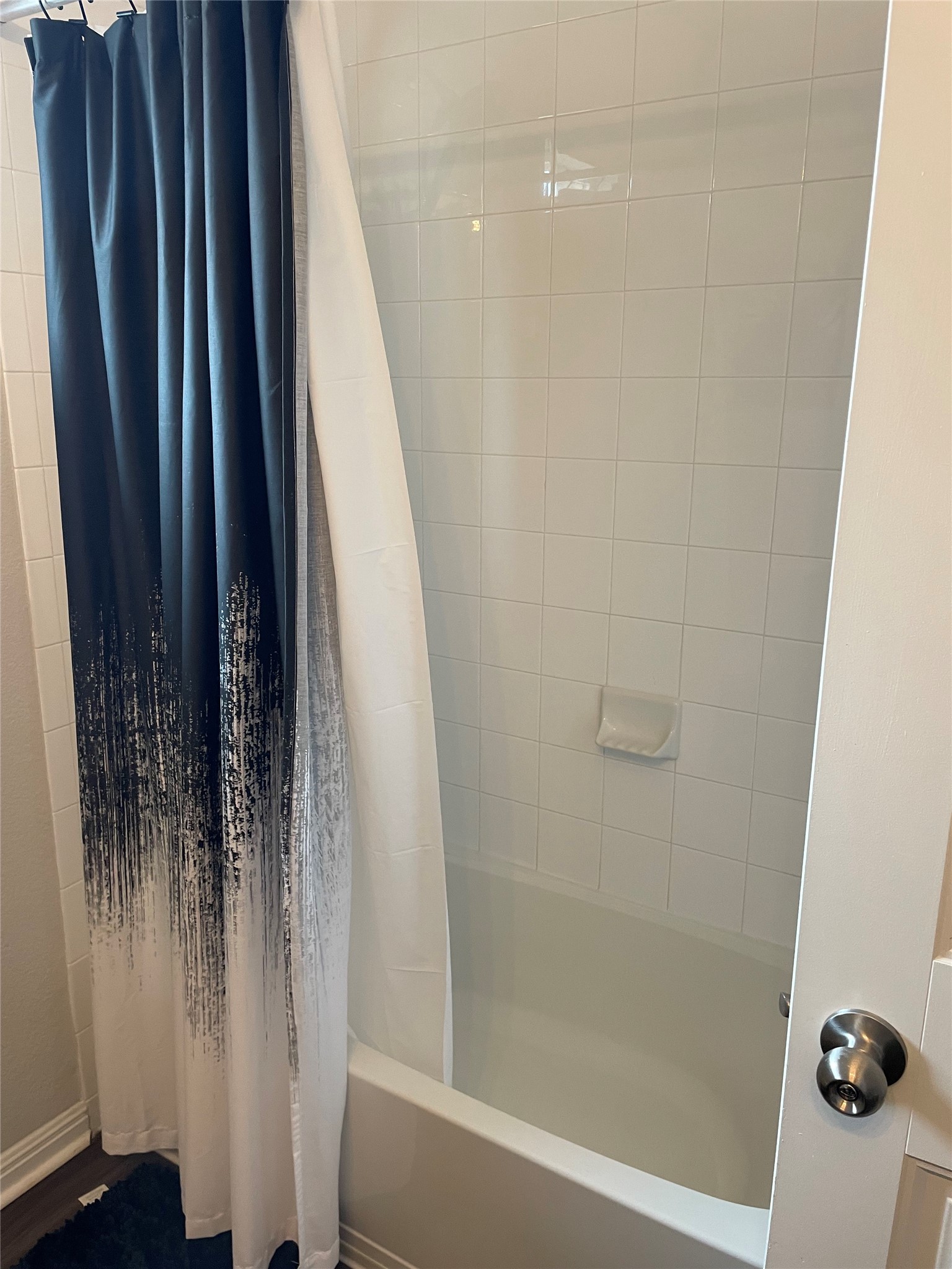 317 Bremen Street Georgetown, TX 78626 - Photo 10 of 19 a bathroom with a shower and a tub