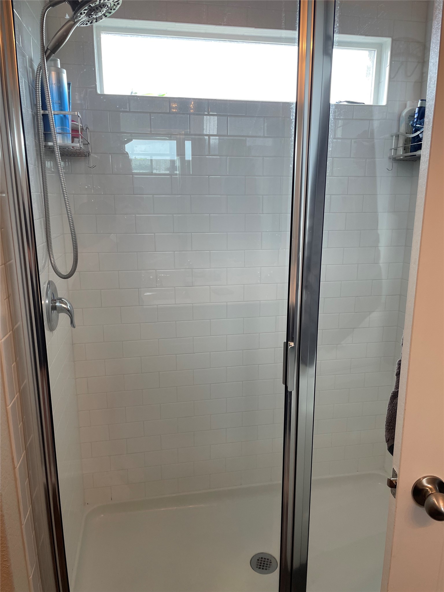 317 Bremen Street Georgetown, TX 78626 - Photo 6 of 19 a bathroom with a glass shower door