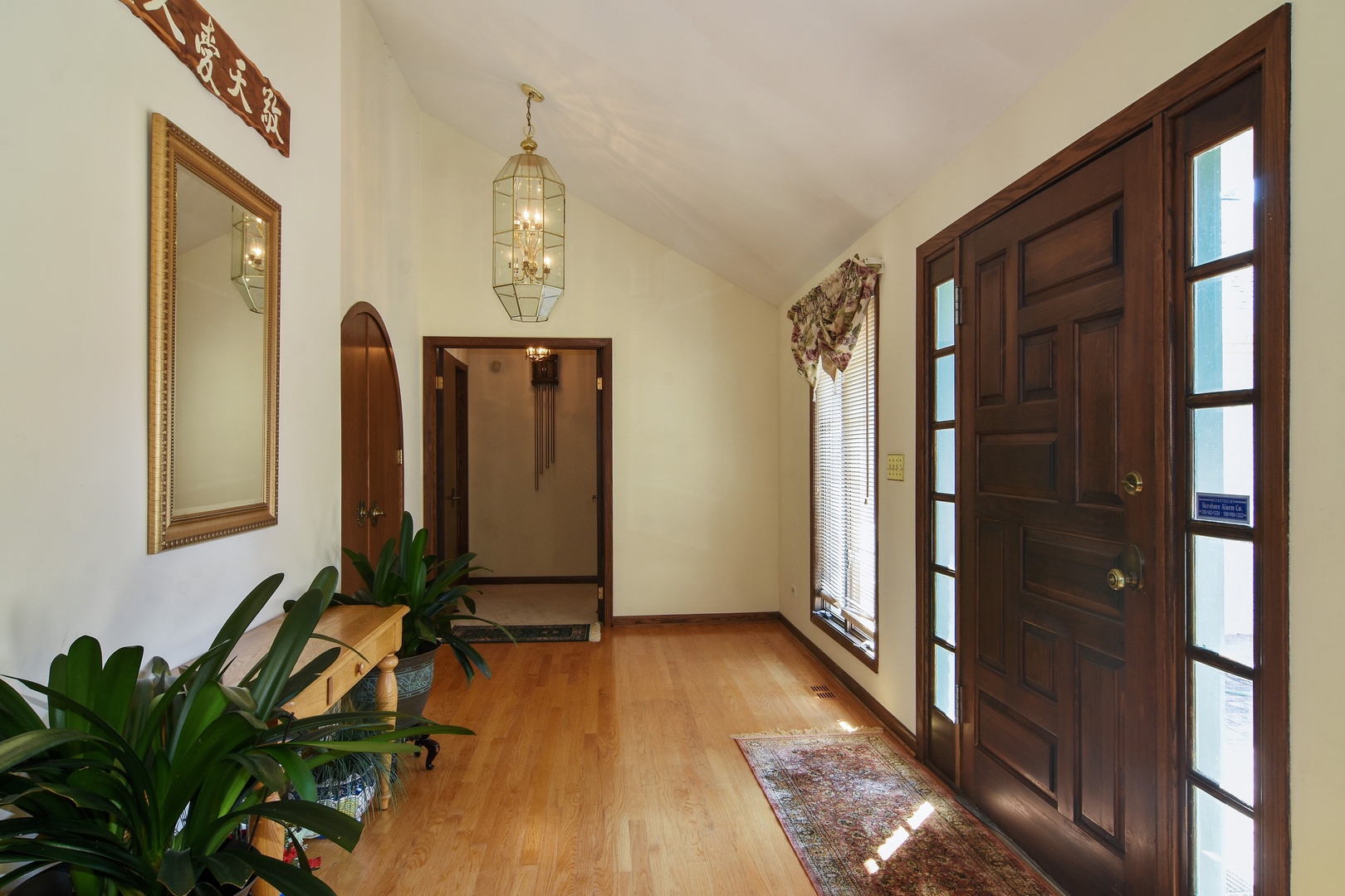 593 Scots Court Inverness, IL 60067 - Photo 5 of 15 a view of a hallway with wooden floor and stairs