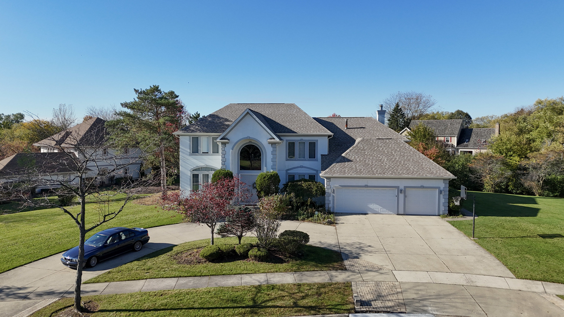 2015 Tree Farm Court Buffalo Grove, IL 60089 - Photo 2 of 100 a front view of a house with a yard and garage