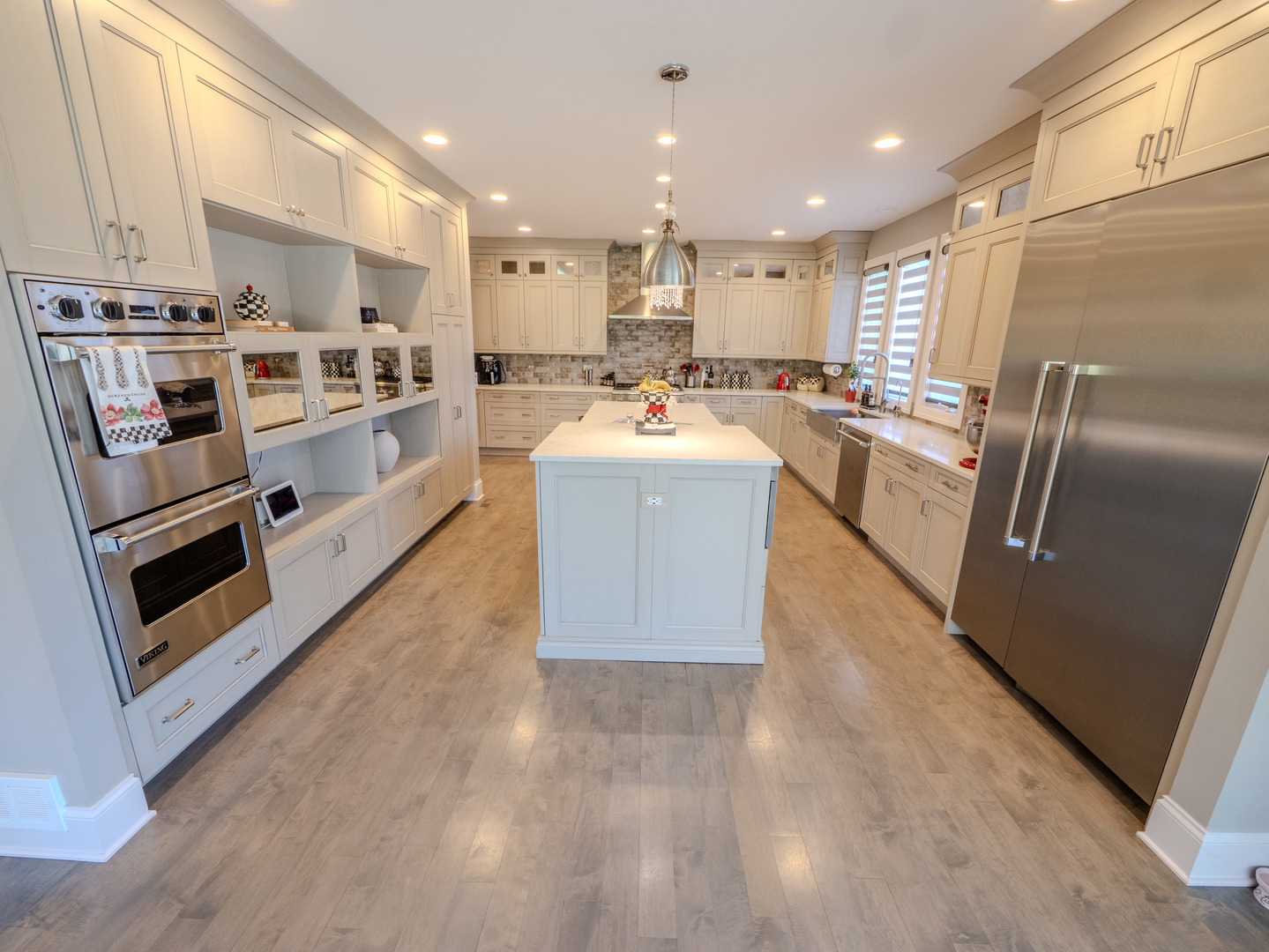 2015 Tree Farm Court Buffalo Grove, IL 60089 - Photo 51 of 100 a large kitchen with stainless steel appliances granite countertop a large counter top a stove a sink and a refrigerator