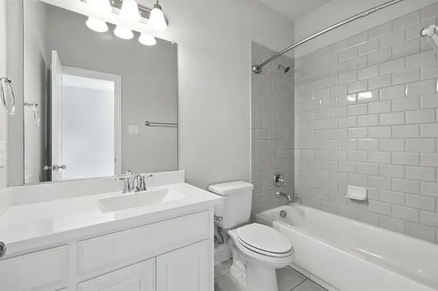 a bathroom with a sink a toilet and a bathtub