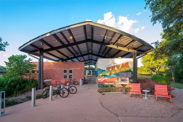 a view of swimming pool with sitting area