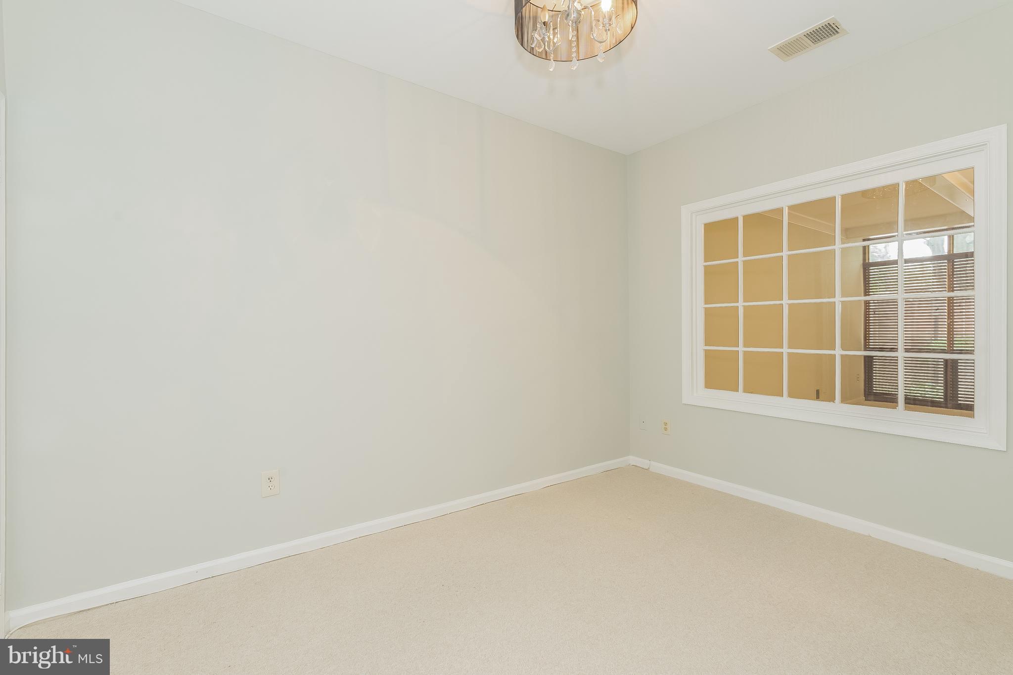 8302 Rising Ridge Way Bethesda, MD 20817 - Photo 14 of 24 a view of an empty room with a window