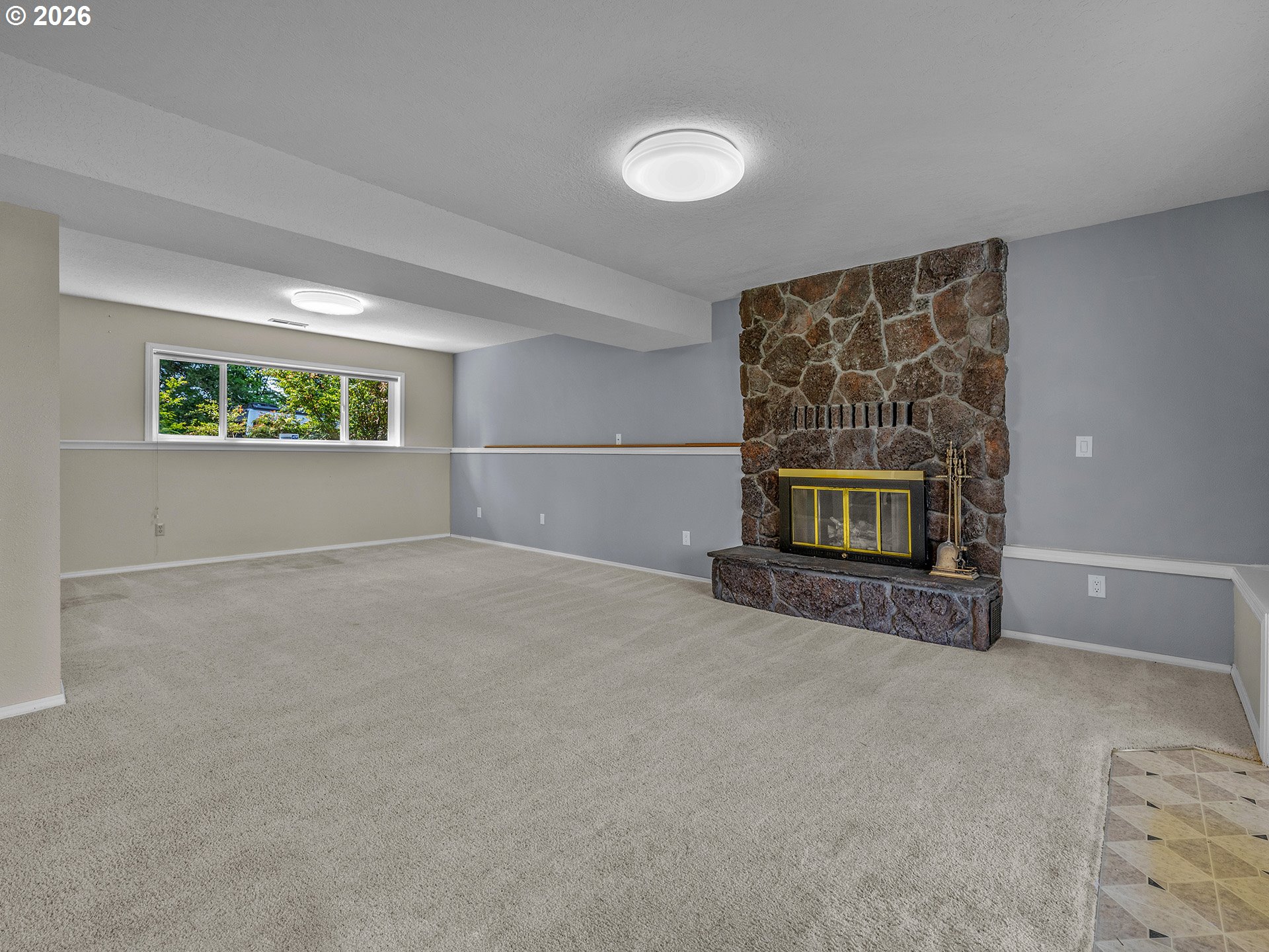 26309 Southwest Vanderschuere Road Hillsboro, OR 97123 - Photo 29 of 48 an empty room with windows and fireplace