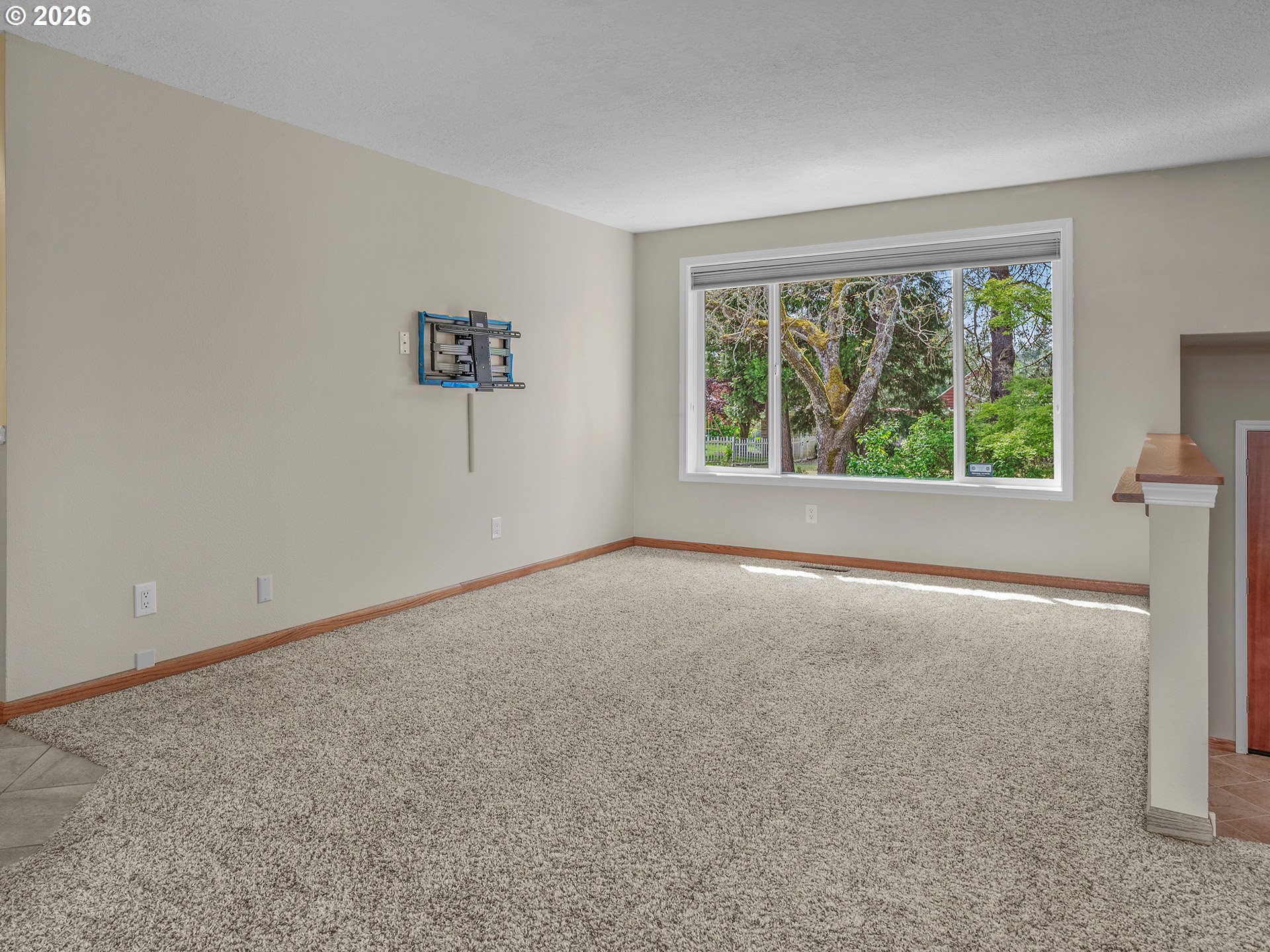 26309 Southwest Vanderschuere Road Hillsboro, OR 97123 - Photo 5 of 48 a view of an empty room with a window