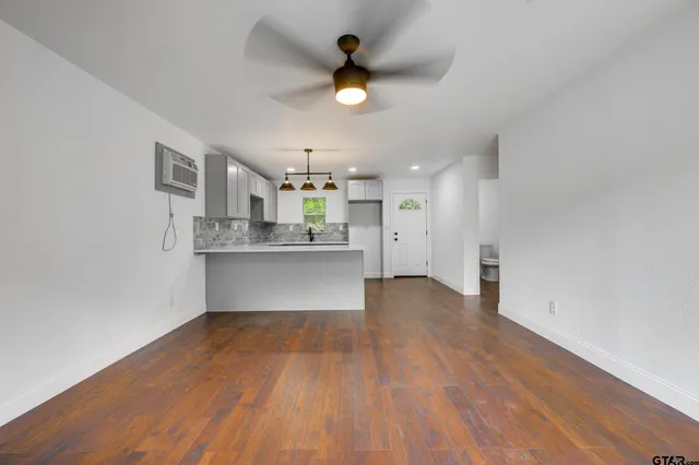 a view of kitchen with wooden floor and window