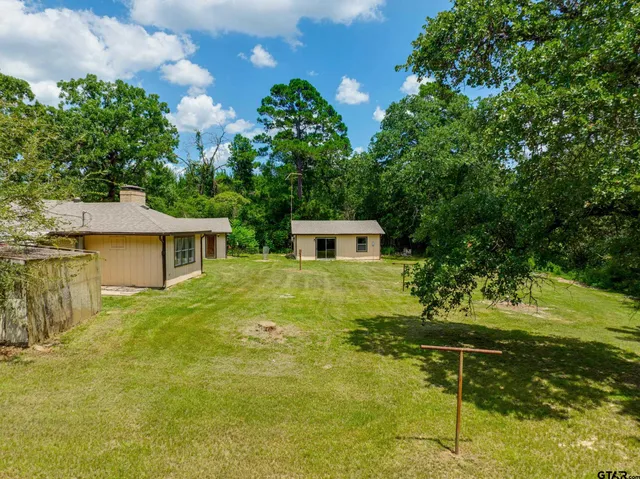 a house view with a garden space