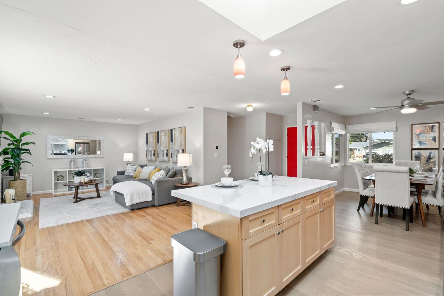 5074 Williams Road San Jose, CA 95129 - Photo 14 of 35 a large living room with stainless steel appliances kitchen island a table chairs and a refrigerator
