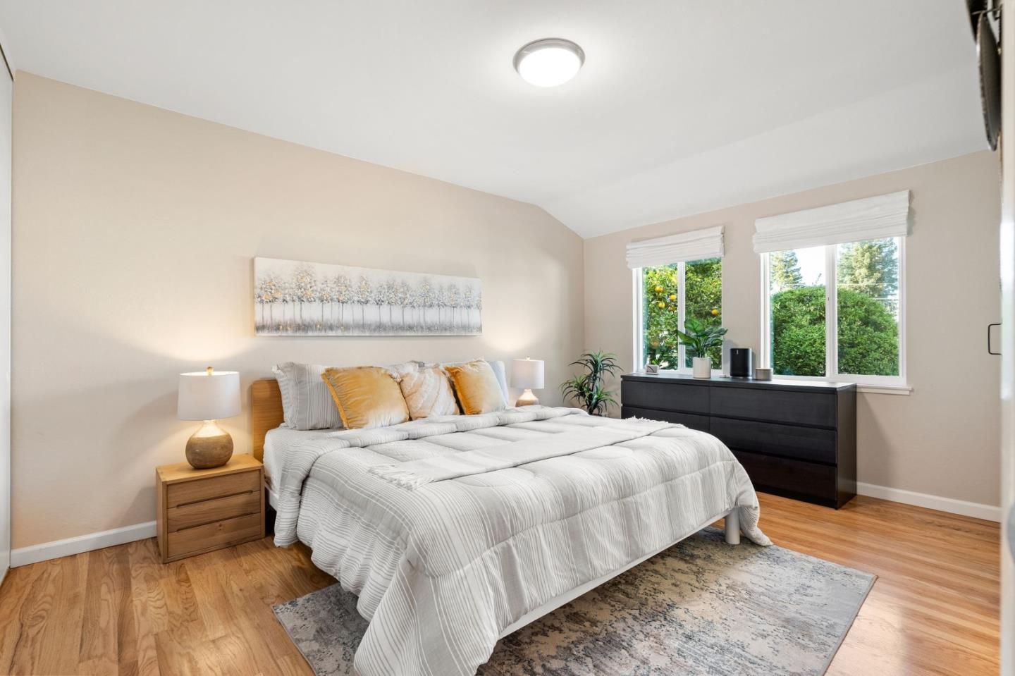 5074 Williams Road San Jose, CA 95129 - Photo 16 of 35 a bedroom with a bed and a large window