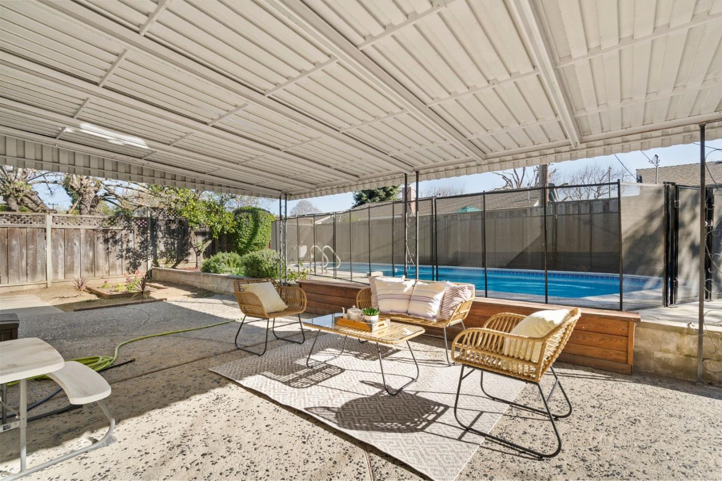 5074 Williams Road San Jose, CA 95129 - Photo 23 of 35 a view of a patio with a table and chairs