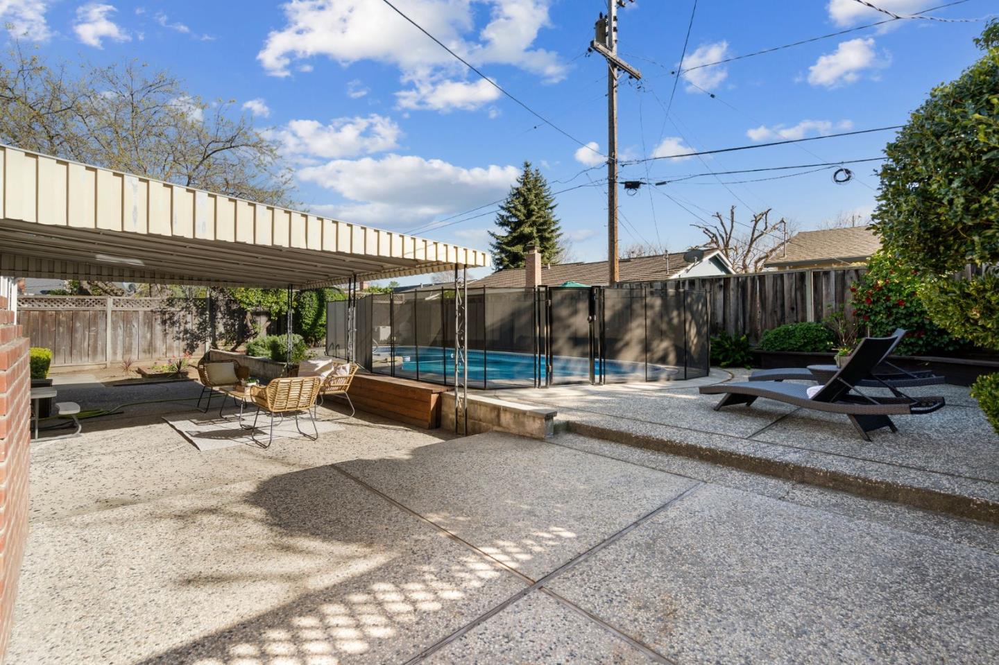 5074 Williams Road San Jose, CA 95129 - Photo 24 of 35 a view of a patio with a table and chairs under an umbrella with a patio