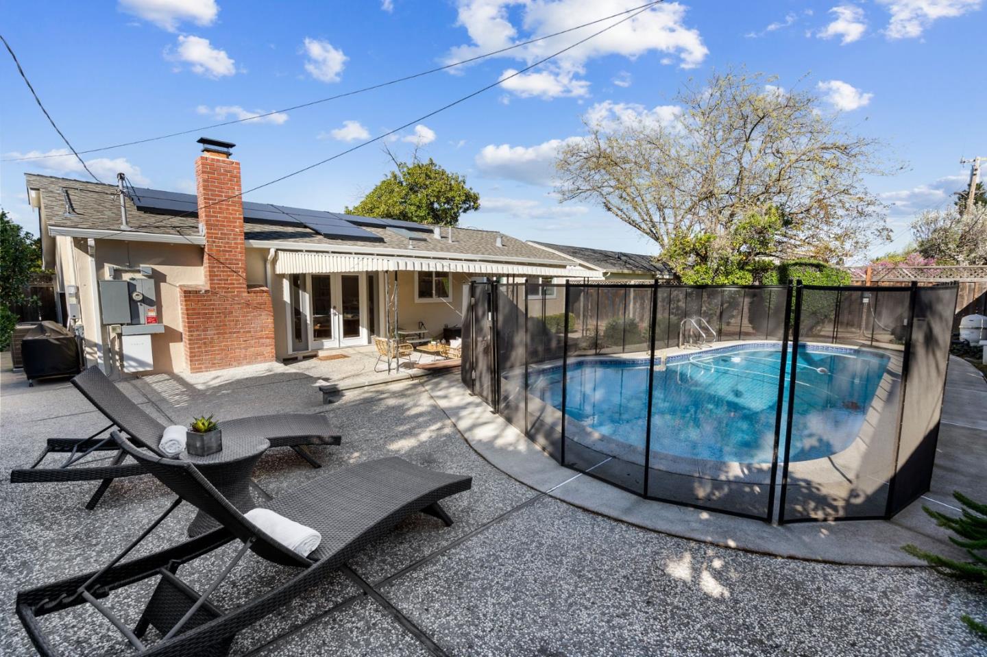 5074 Williams Road San Jose, CA 95129 - Photo 25 of 35 a view of a patio with table and chairs with wooden floor and fence