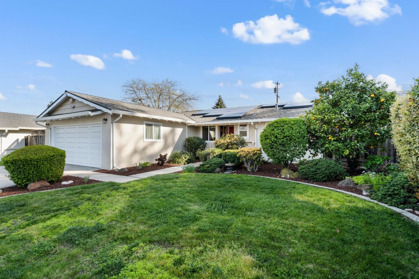 5074 Williams Road San Jose, CA 95129 - Photo 3 of 35 a front view of a house with a yard and garage