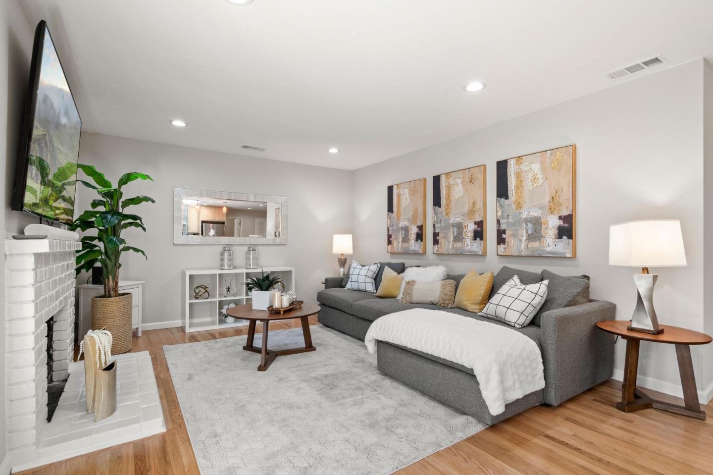 5074 Williams Road San Jose, CA 95129 - Photo 5 of 35 a living room with furniture and a lamp