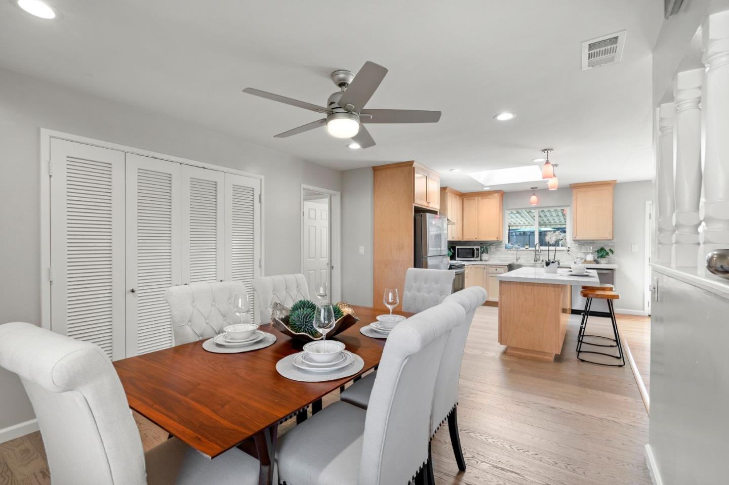 5074 Williams Road San Jose, CA 95129 - Photo 9 of 35 a view of a dining room with furniture and a potted plant