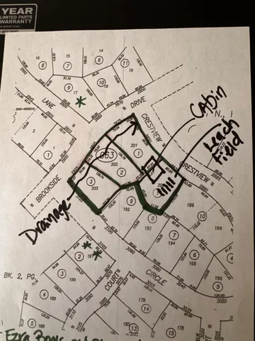 a view of a yard with a tree