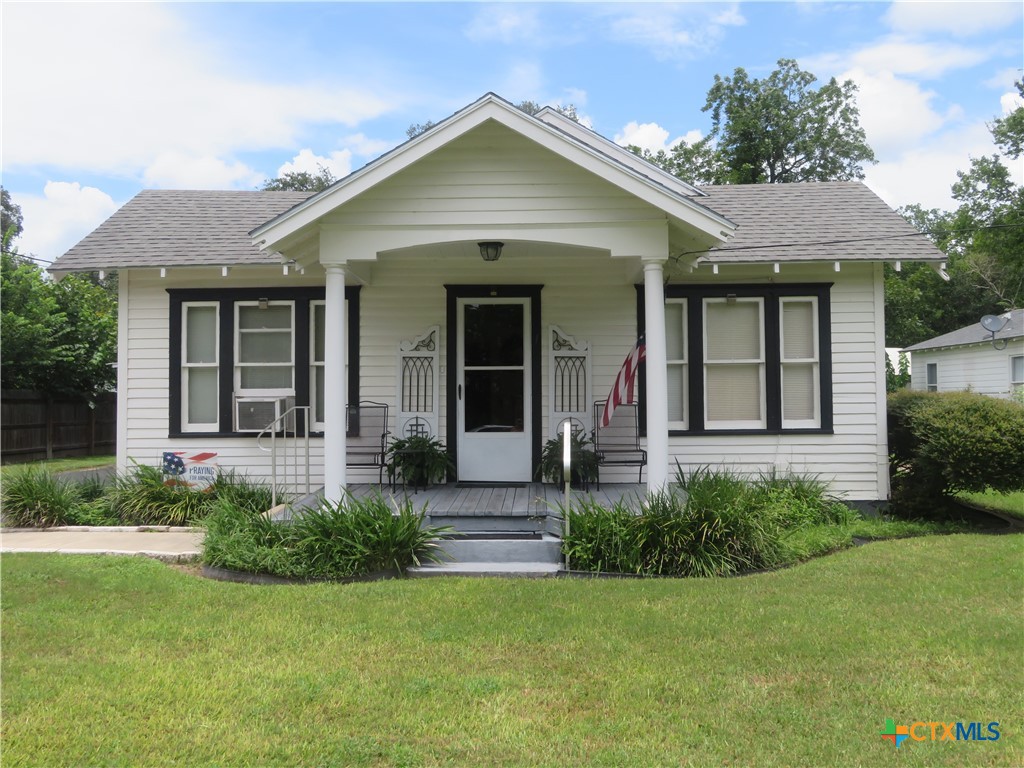 front view of a house with a yard