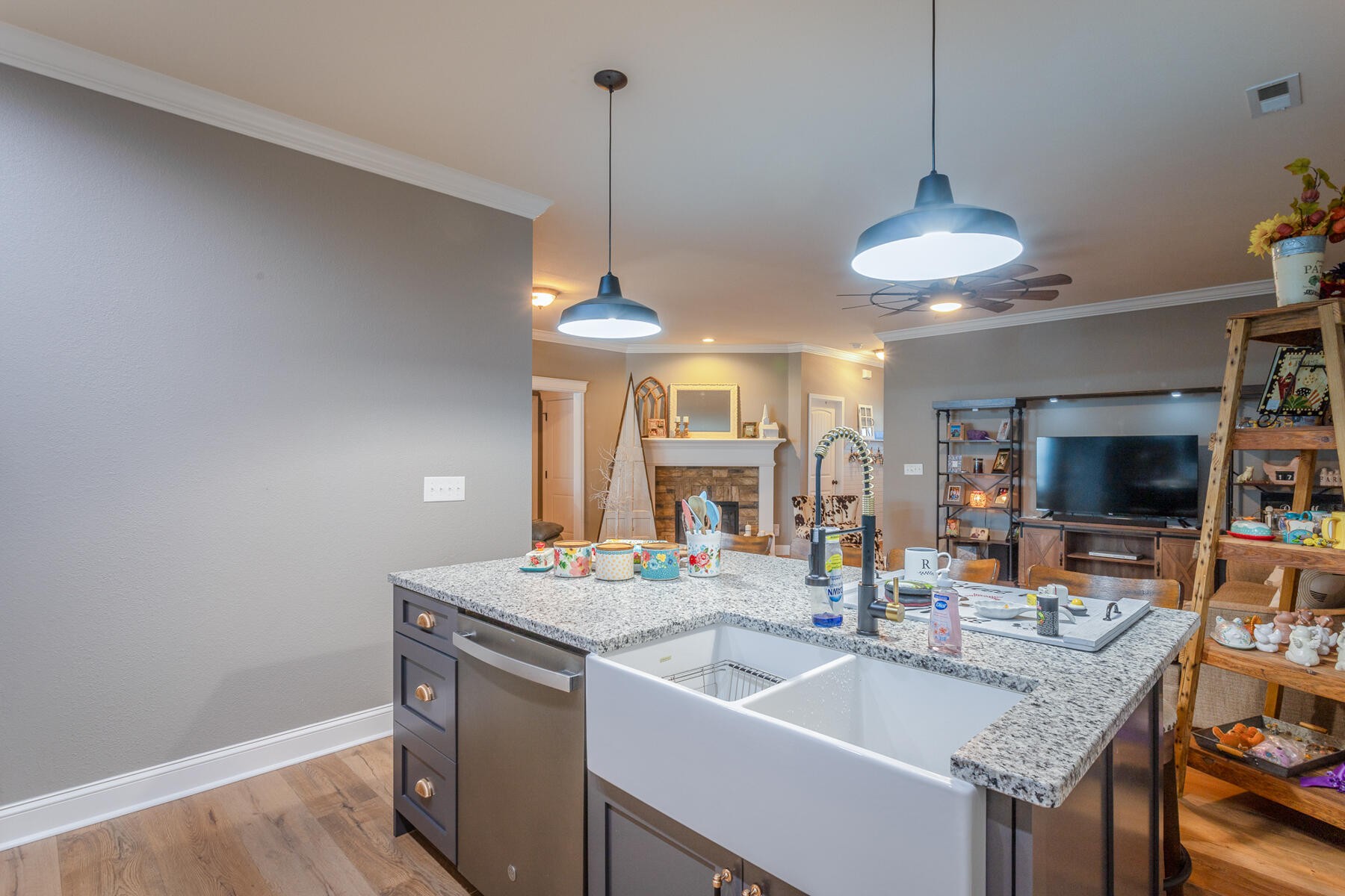 875 Colony Circle Fort Oglethorpe, GA 30742 - Photo 11 of 42 a kitchen with a sink a counter space appliances and cabinets