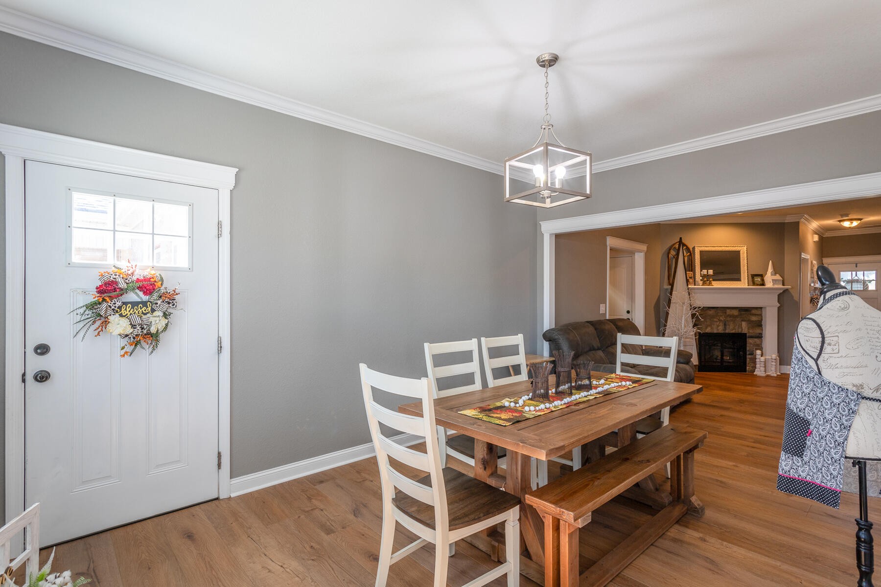 875 Colony Circle Fort Oglethorpe, GA 30742 - Photo 14 of 42 a view of a dining room with furniture a chandelier and wooden floor