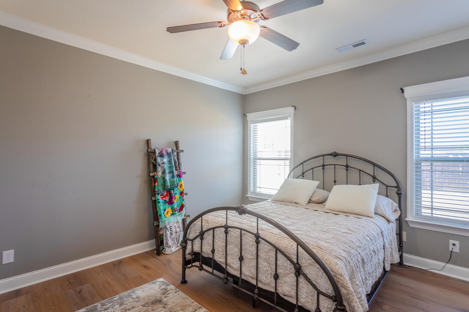 875 Colony Circle Fort Oglethorpe, GA 30742 - Photo 21 of 42 a bedroom with a bed and a chandelier
