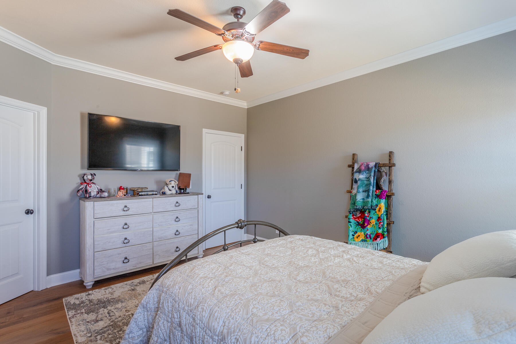 875 Colony Circle Fort Oglethorpe, GA 30742 - Photo 22 of 42 a bed room with a bed a television and a dresser