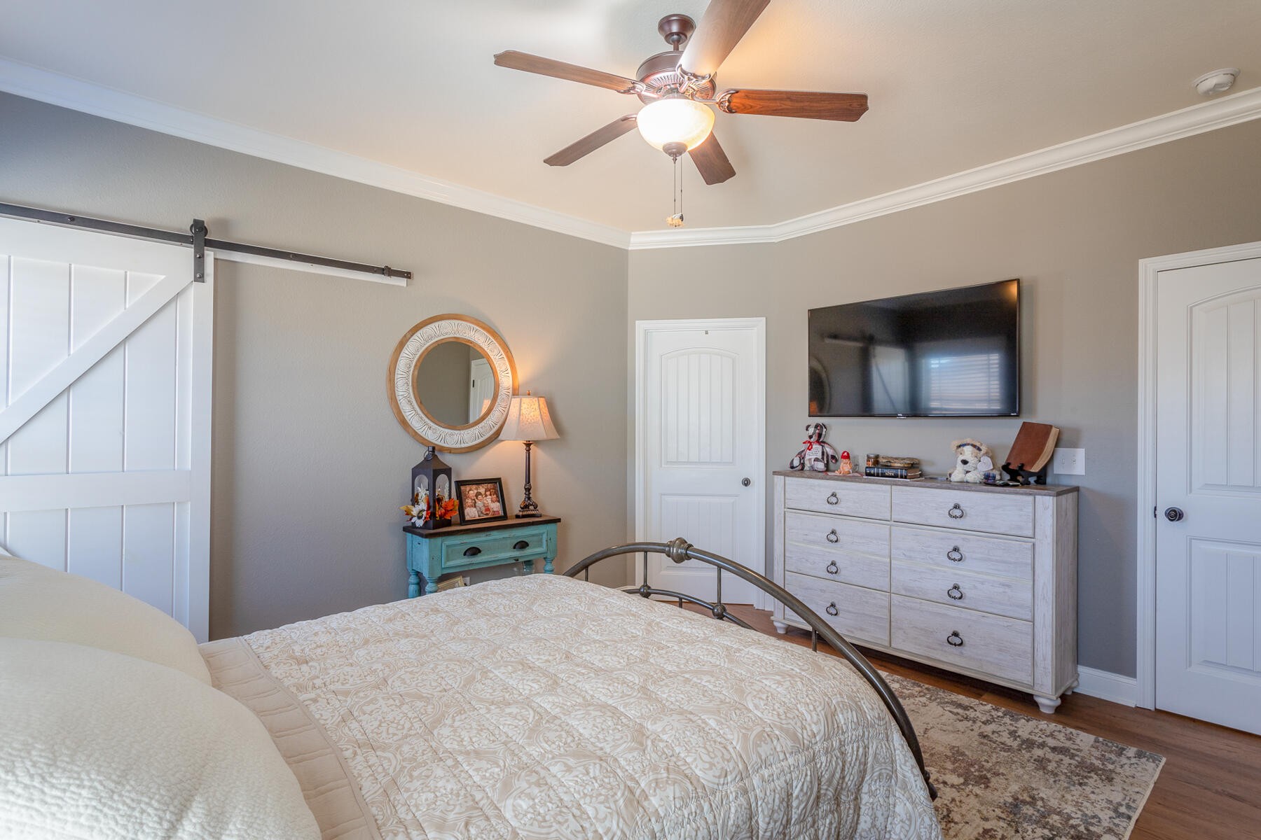 875 Colony Circle Fort Oglethorpe, GA 30742 - Photo 23 of 42 a bedroom with a bed and a flat screen tv