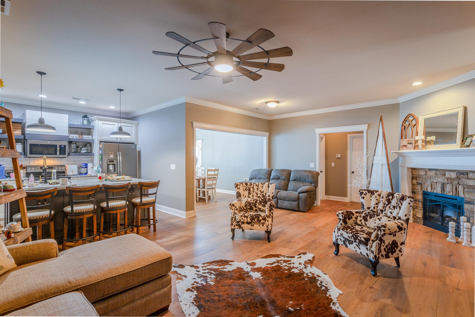 875 Colony Circle Fort Oglethorpe, GA 30742 - Photo 7 of 42 a living room with fireplace furniture and a chandelier