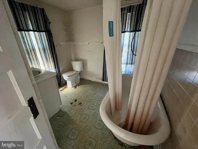 a bathroom with a toilet and a sink