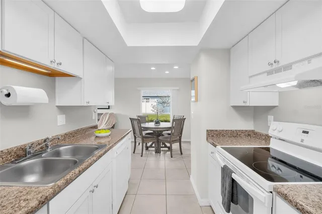 a kitchen with a stove and a refrigerator