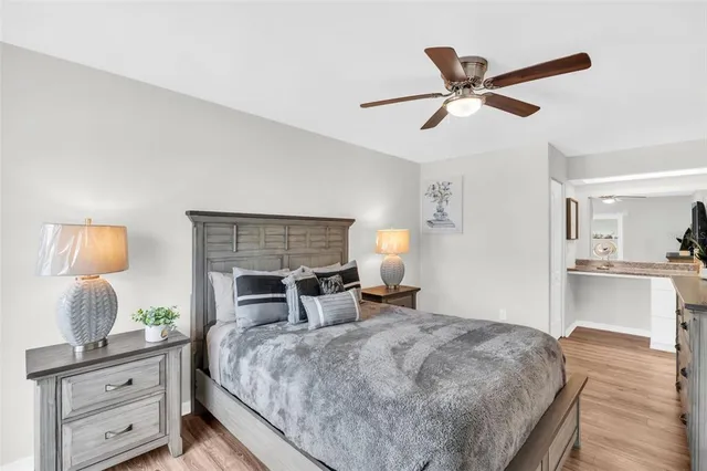 a bedroom with a bed and a television