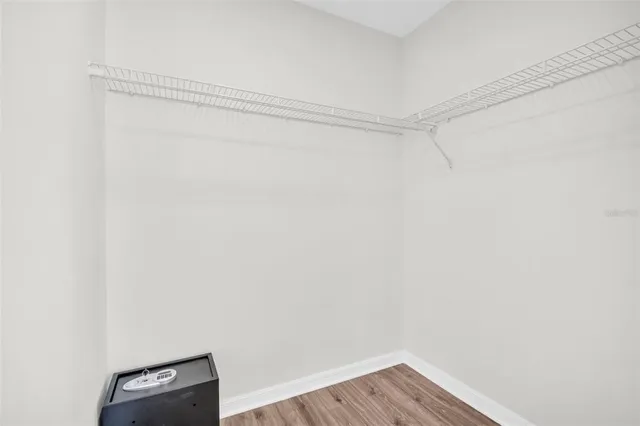 a bathroom with a granite countertop sink a toilet and a mirror