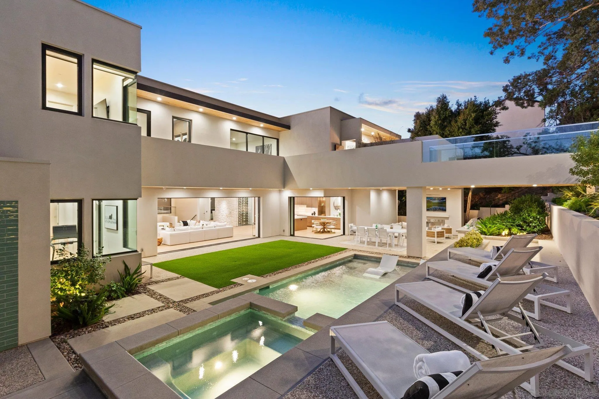 a view of a house with backyard porch and sitting area