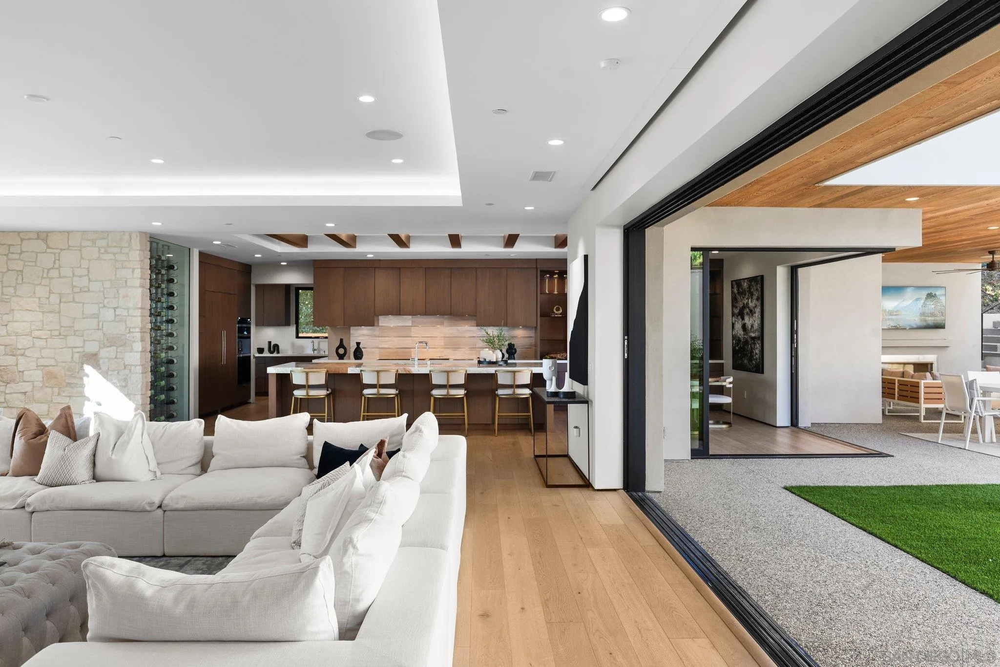 6349 Castejon Drive La Jolla, CA 92037 - Photo 19 of 43 a living room with furniture and a wooden floor