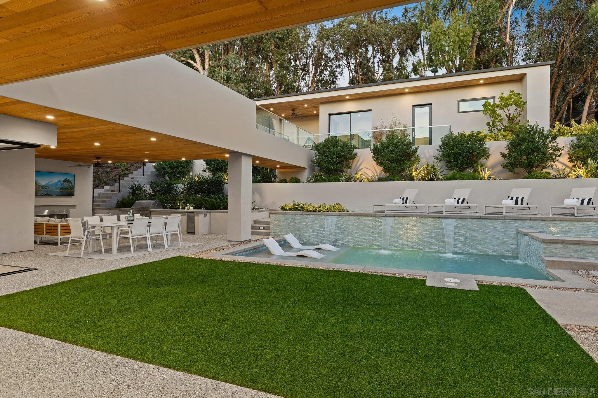6349 Castejon Drive La Jolla, CA 92037 - Photo 20 of 43 a view of house with swimming pool and a yard