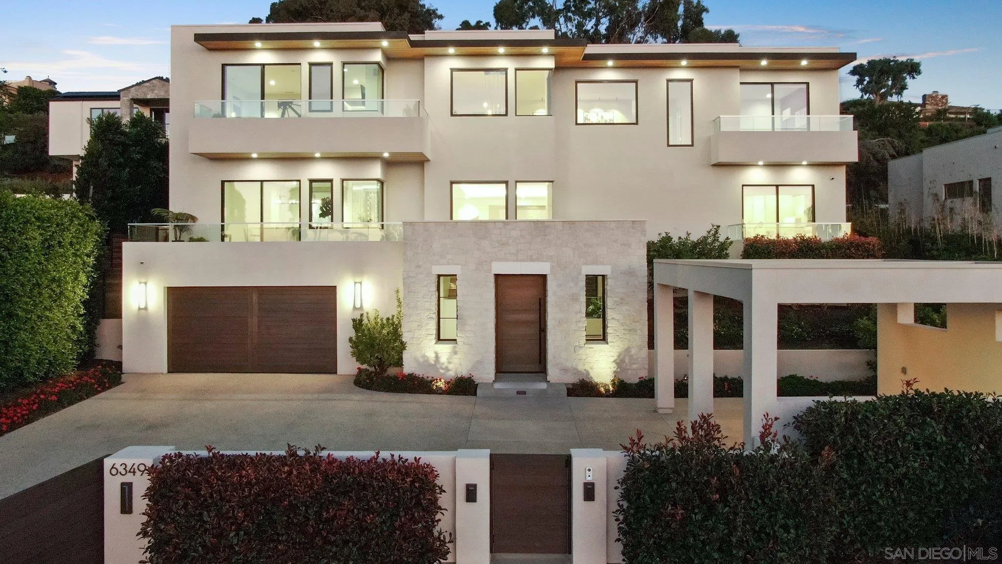 6349 Castejon Drive La Jolla, CA 92037 - Photo 2 of 43 a front view of a house with a yard