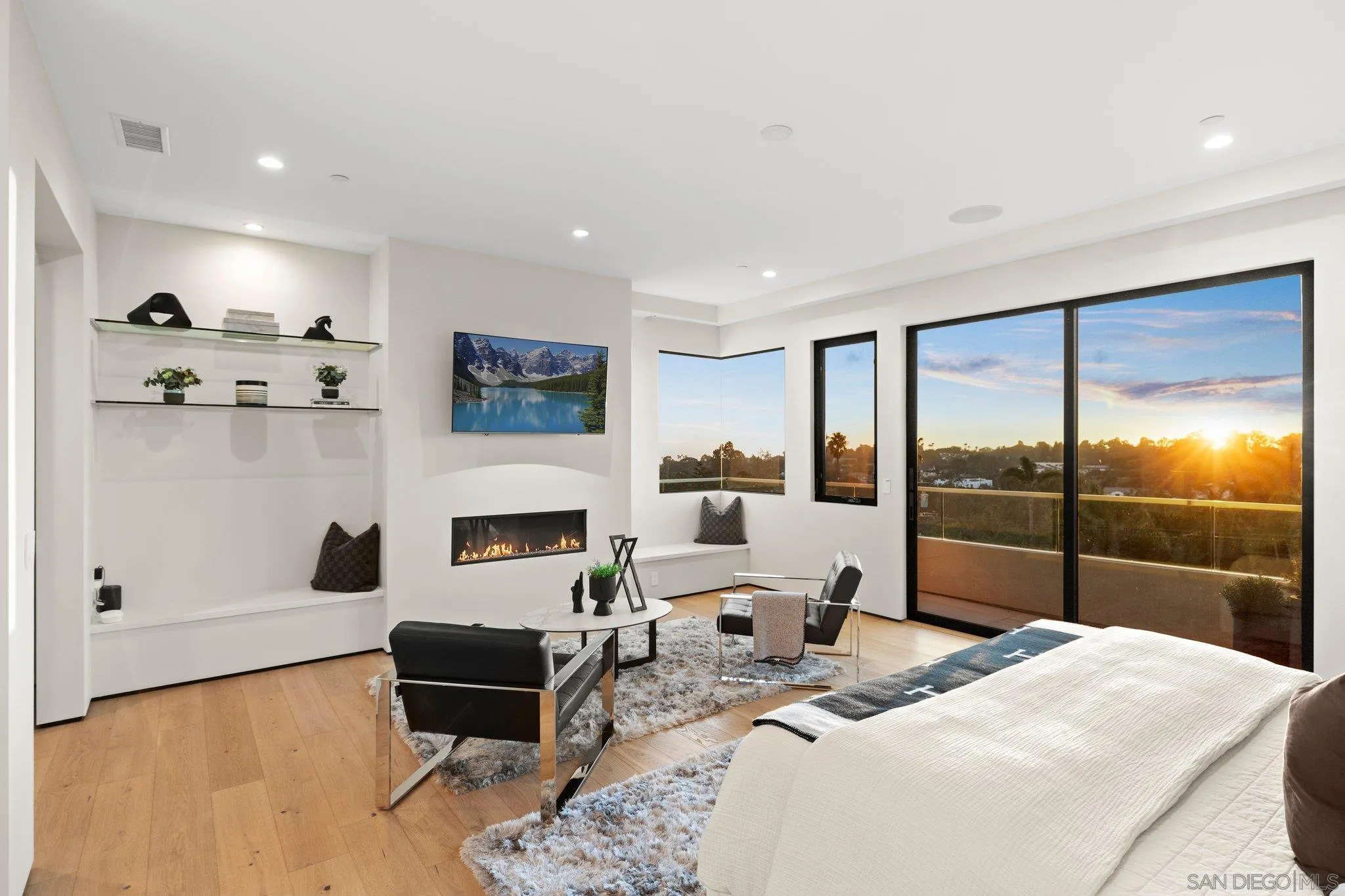 6349 Castejon Drive La Jolla, CA 92037 - Photo 26 of 43 a bedroom with furniture and a fireplace