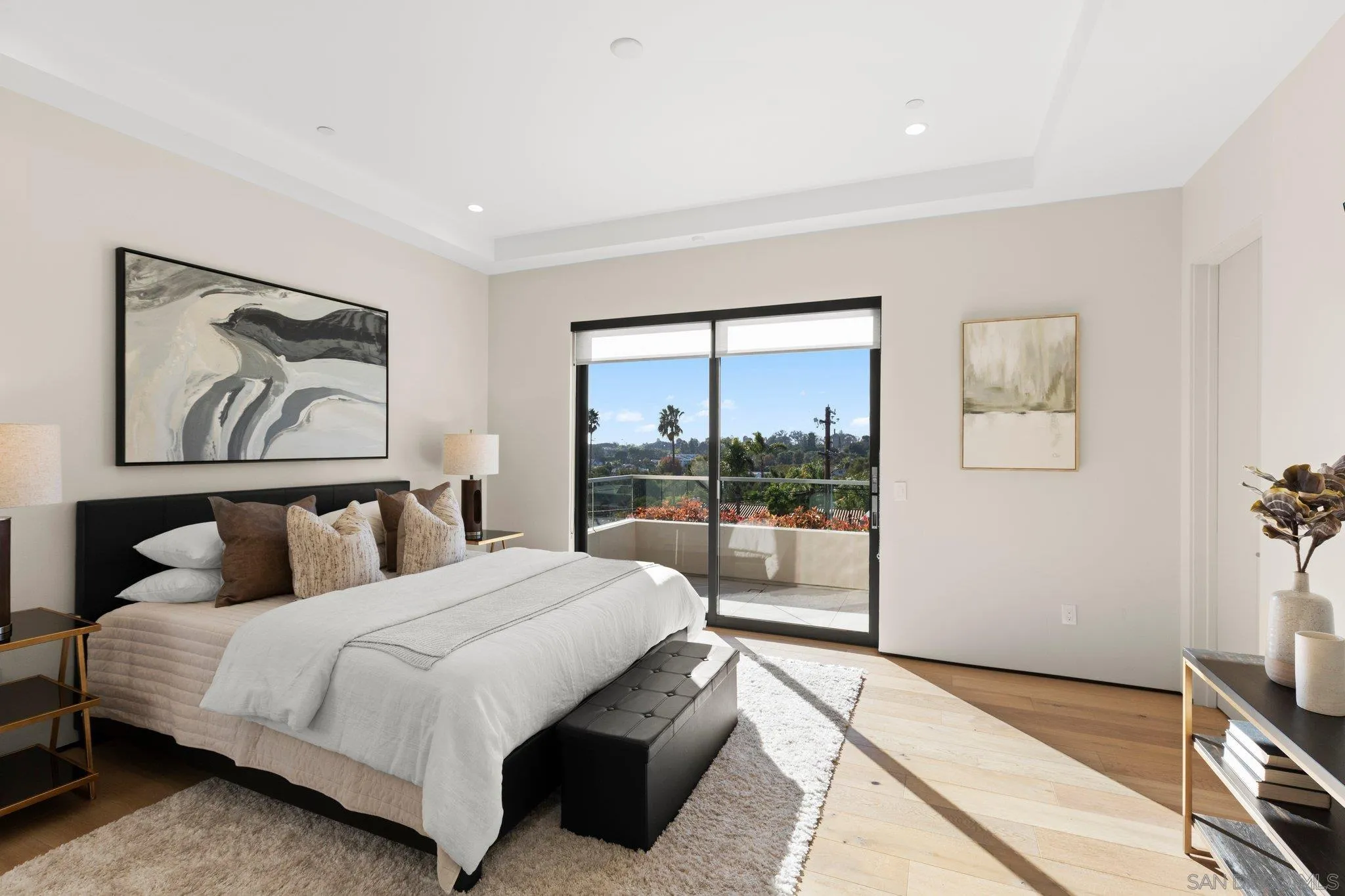 6349 Castejon Drive La Jolla, CA 92037 - Photo 36 of 43 a bedroom with a large bed and a painting on the wall