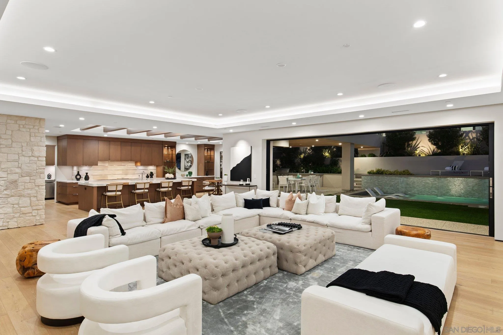 6349 Castejon Drive La Jolla, CA 92037 - Photo 4 of 43 a living room with furniture large window and flat screen tv