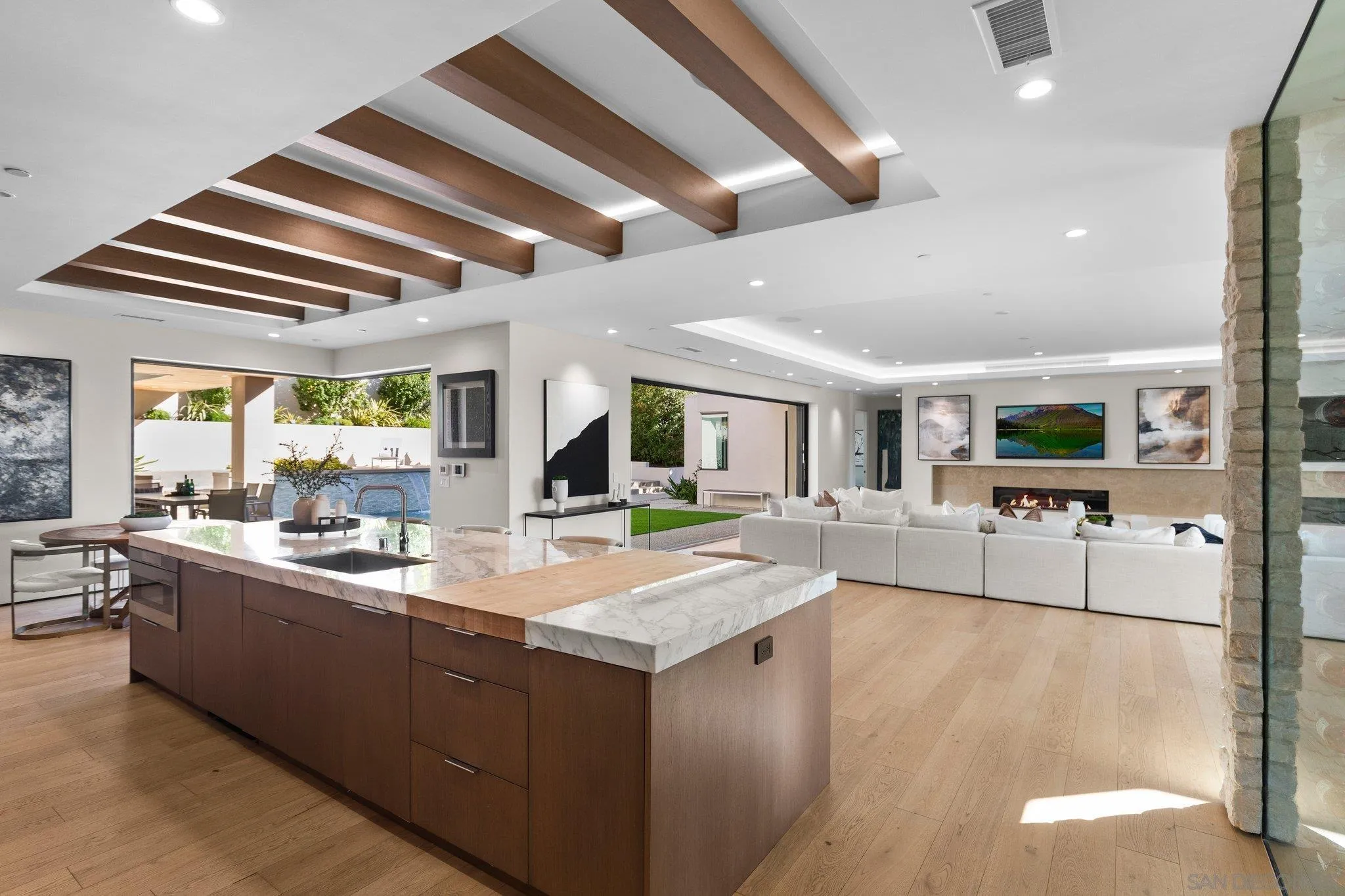 6349 Castejon Drive La Jolla, CA 92037 - Photo 8 of 43 a large living room with stainless steel appliances granite countertop furniture and a large window