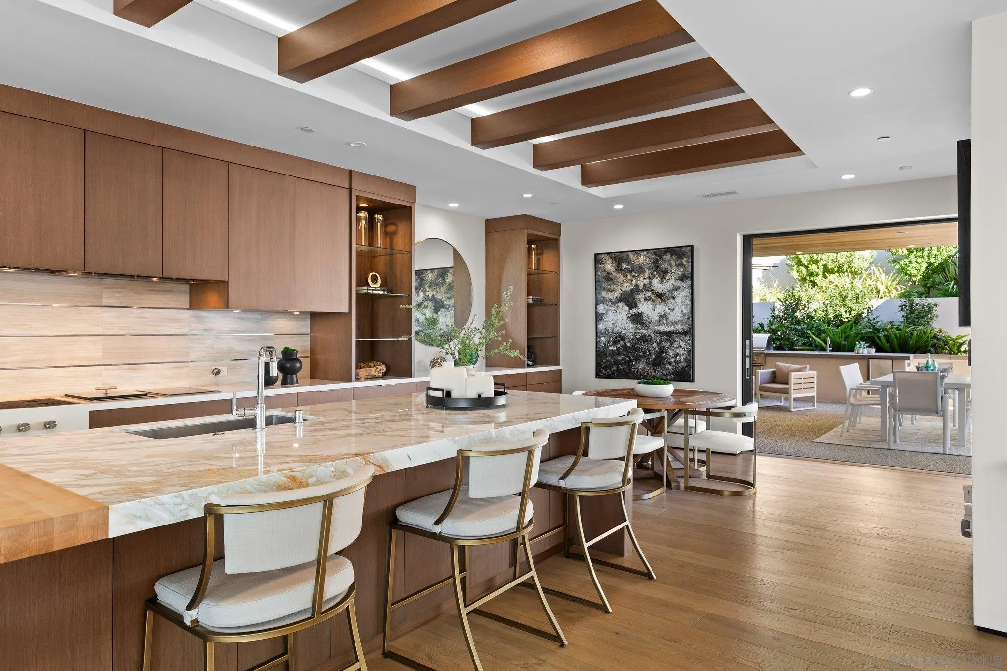 6349 Castejon Drive La Jolla, CA 92037 - Photo 10 of 43 a kitchen with a table chairs stove and cabinets
