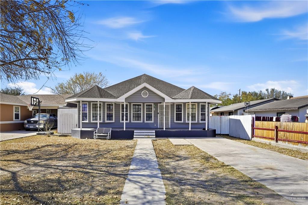 121 Jo Beth Street Alton, TX 78573 - Photo 1 of 12 a front view of a house with a yard
