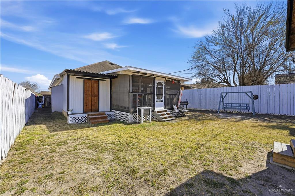 121 Jo Beth Street Alton, TX 78573 - Photo 12 of 12 a view of a house with a large tree and wooden fence