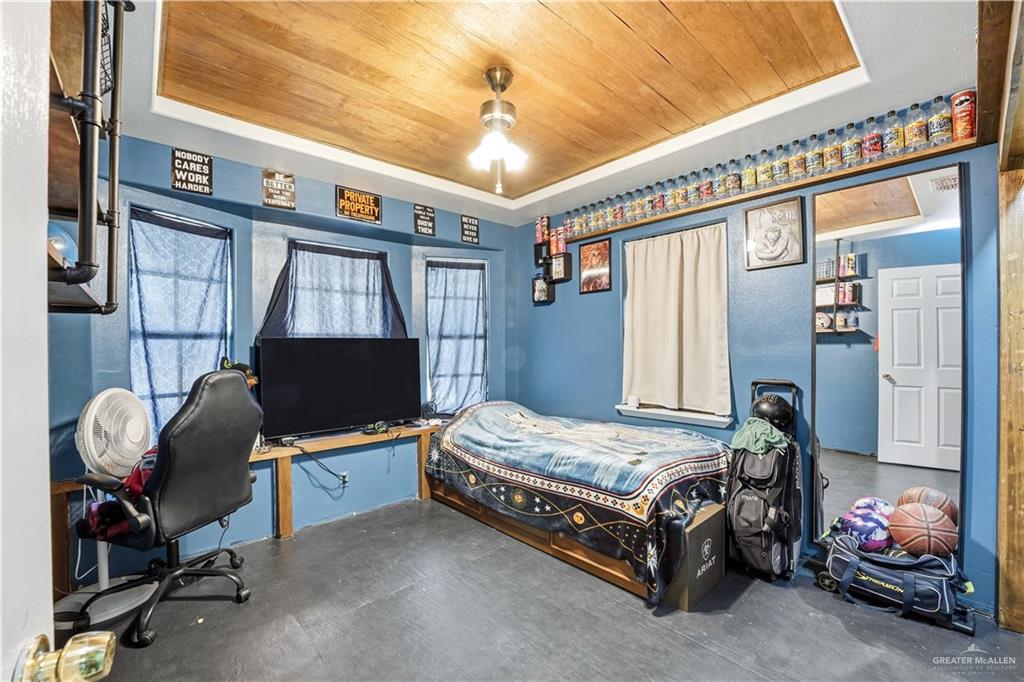 121 Jo Beth Street Alton, TX 78573 - Photo 7 of 12 a bedroom with a bed chair and window