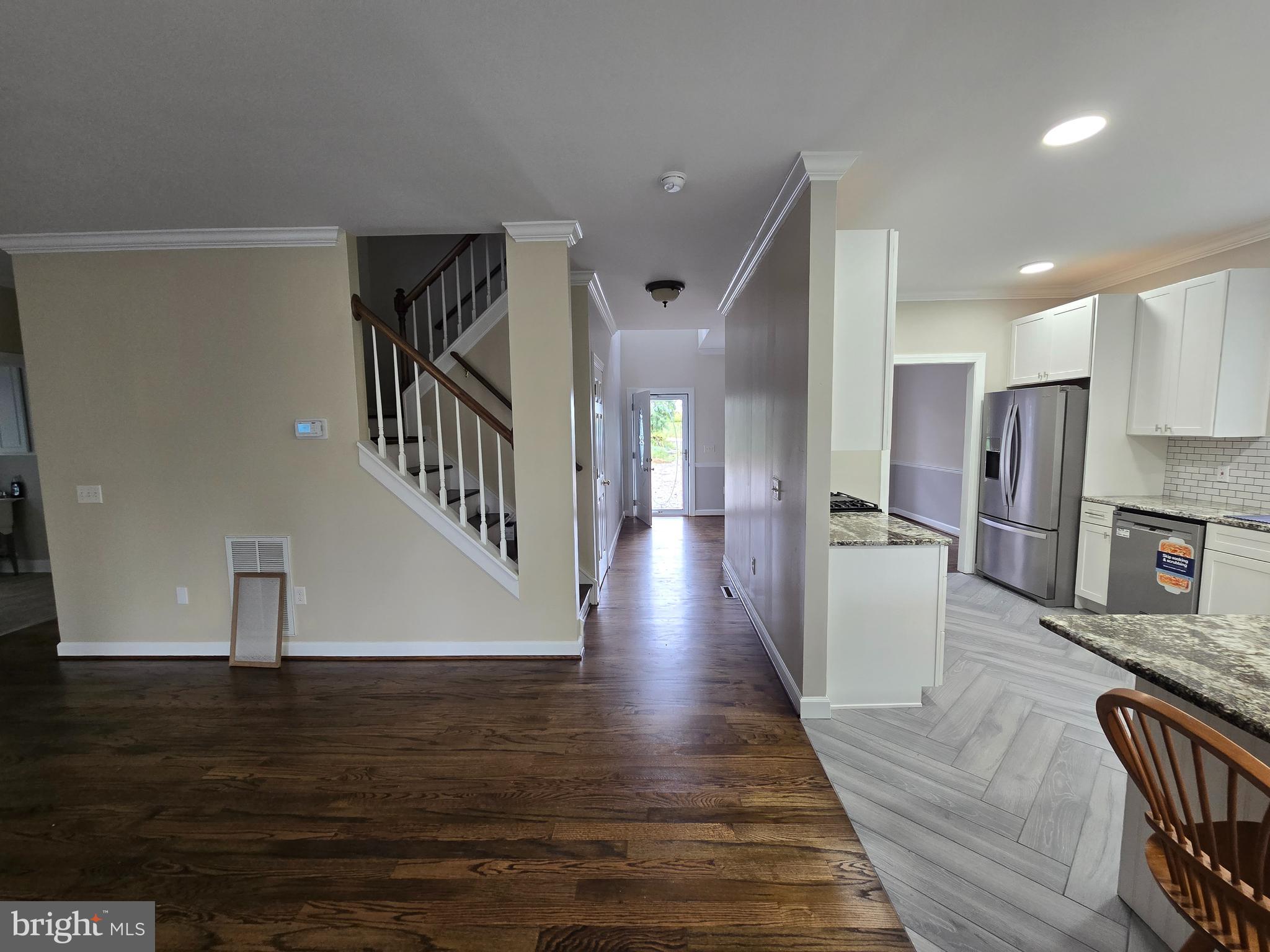 32155 River Road Millington, MD 21651 - Photo 20 of 54 a view of a living room with wooden floor and a kitchen