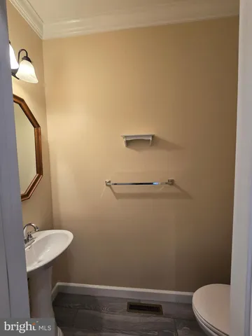 a bathroom with a sink a toilet